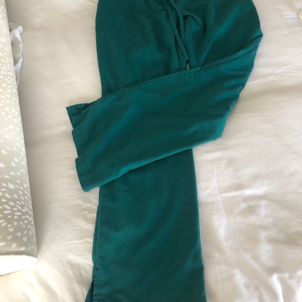 Four pairs of scrub pants.